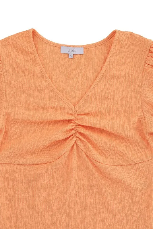 Shirred V neck top with puff sleeves